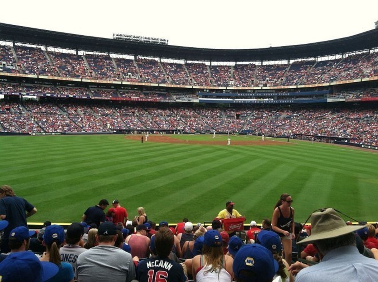 Professional security guard managing crowd at a sports event.