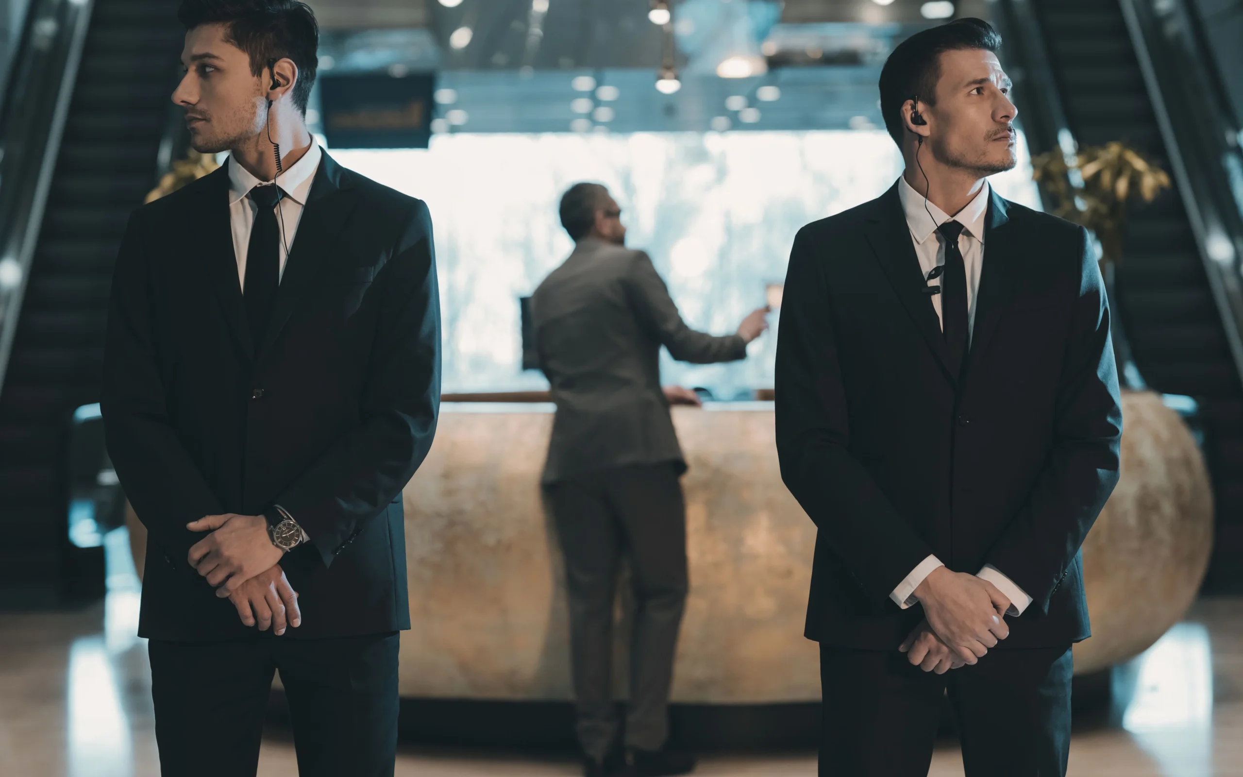 Hotel security guards standing firm, monitoring for any unusual activity to ensure the safety of the premises and guests.