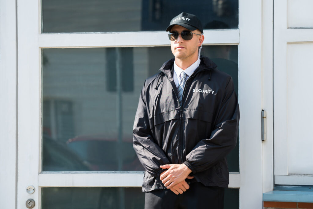 Professional security public library guard monitoring library entrance